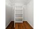 Walk-in closet with shelving and wood flooring at 2522 Clubhouse Dr # 204, Sarasota, FL 34232