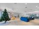 Spacious community room with a Christmas tree and seating at 2522 Clubhouse Dr # 204, Sarasota, FL 34232