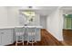 Kitchen with white cabinets and breakfast bar at 2522 Clubhouse Dr # 204, Sarasota, FL 34232