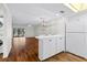 Modern kitchen with white cabinets and breakfast bar at 2522 Clubhouse Dr # 204, Sarasota, FL 34232