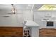 Bright kitchen features white cabinetry, modern appliances, and a breakfast bar at 2522 Clubhouse Dr # 204, Sarasota, FL 34232