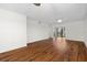 Living room with hardwood floors and access to balcony at 2522 Clubhouse Dr # 204, Sarasota, FL 34232
