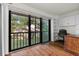 Bright home office with built-in shelving and balcony access at 2522 Clubhouse Dr # 204, Sarasota, FL 34232