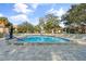 Inviting community pool with plenty of lounge chairs at 2522 Clubhouse Dr # 204, Sarasota, FL 34232
