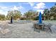 Relaxing pool area with tables and chairs at 2522 Clubhouse Dr # 204, Sarasota, FL 34232