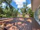 Large wooden back deck with a wooden perimeter and a backyard view at 2724 Ashton Rd, Sarasota, FL 34231