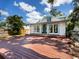 The back exterior features a spacious deck with glass doors and a well-maintained yard at 2724 Ashton Rd, Sarasota, FL 34231