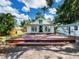 Back exterior features a large wooden deck perfect for entertaining and features plenty of yard space at 2724 Ashton Rd, Sarasota, FL 34231