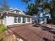 House with backyard wooden deck and tropical landscaping at 2724 Ashton Rd, Sarasota, FL 34231