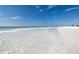Scenic view of a serene beach with clear water and a sandy shore at 2724 Ashton Rd, Sarasota, FL 34231
