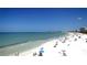 Beautiful beach with clear turquoise water and people enjoying the sunshine at 2724 Ashton Rd, Sarasota, FL 34231