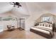 Cozy bedroom with vaulted ceiling, natural light, and hardwood floors at 2724 Ashton Rd, Sarasota, FL 34231