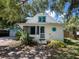 Beautiful curb appeal, landscaping, detached garage, and front porch of a quaint single Gathering home at 2724 Ashton Rd, Sarasota, FL 34231