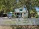 Charming house with a white picket fence and lovely curb appeal with detached garage at 2724 Ashton Rd, Sarasota, FL 34231