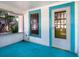 Bright porch with blue painted floors and screened windows at 2724 Ashton Rd, Sarasota, FL 34231