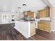 Kitchen boasts light wood cabinets, stainless steel appliances, and a breakfast bar at 2724 Ashton Rd, Sarasota, FL 34231