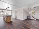 Living room with dark hardwood floors and a view of the kitchen and staircase at 2724 Ashton Rd, Sarasota, FL 34231