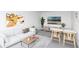 Modern living space with bright artwork, sleek furnishings, and dining area at 2724 Ashton Rd, Sarasota, FL 34231