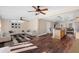 Spacious living room with hardwood floors seamlessly connected to the open kitchen area at 2724 Ashton Rd, Sarasota, FL 34231