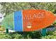 Siesta Key Village sign with vibrant colors and landscaping at 2724 Ashton Rd, Sarasota, FL 34231