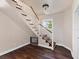 Elegant staircase with a white railing leading to the upper level at 2724 Ashton Rd, Sarasota, FL 34231