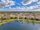 An aerial view of the home with a pond view at 27475 Janzen Ct, Englewood, FL 34223