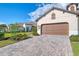 Paved driveway leading to a two-car garage at 27475 Janzen Ct, Englewood, FL 34223