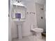 Updated bathroom with pedestal sink, toilet, and a walk-in shower at 2902 23Rd W Ave, Bradenton, FL 34205