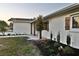 Side view of the home showcasing new paint and landscaping at 2902 23Rd W Ave, Bradenton, FL 34205