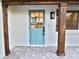 Charming teal front door with wood accents and brick walkway at 2902 23Rd W Ave, Bradenton, FL 34205