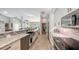 Modern kitchen with granite countertops, stainless steel appliances, and farmhouse sink at 2910 Longleat Woods, Sarasota, FL 34235