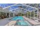 Large screened pool and spa with patio area at 2910 Longleat Woods, Sarasota, FL 34235