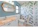 Clean bathroom with a granite countertop, updated toilet and walk-in shower at 3001 Vivienda Blvd, Bradenton, FL 34207