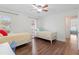 Spacious bedroom with two twin beds, and plenty of natural light at 3001 Vivienda Blvd, Bradenton, FL 34207