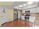 Bright kitchen, featuring stainless steel appliances and light wood laminate flooring at 3001 Vivienda Blvd, Bradenton, FL 34207