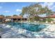 Community pool with plenty of lounge chairs for residents at 3001 Vivienda Blvd, Bradenton, FL 34207