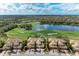 Beautiful aerial view of a golf course community with tile roofs and lush landscaping at 318 Winding Brook Ln # 104, Bradenton, FL 34212