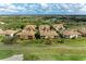 Aerial view of beautiful community showcasing manicured landscaping, lush trees and serene lake at 318 Winding Brook Ln # 104, Bradenton, FL 34212