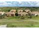 Stunning aerial view of meticulously maintained homes with lush landscaping and mature trees at 318 Winding Brook Ln # 104, Bradenton, FL 34212
