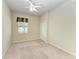 Bedroom featuring a ceiling fan, closet and window that provides natural light at 318 Winding Brook Ln # 104, Bradenton, FL 34212