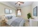 Comfortable bedroom featuring ceiling fan, window, and tasteful decor at 318 Winding Brook Ln # 104, Bradenton, FL 34212