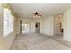 Large bedroom with access to screened lanai and walk-in closets at 318 Winding Brook Ln # 104, Bradenton, FL 34212