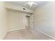 Neutral bedroom featuring a ceiling fan and an open door to the next room at 318 Winding Brook Ln # 104, Bradenton, FL 34212