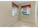 Bright bedroom featuring tile flooring and a golf course view at 318 Winding Brook Ln # 104, Bradenton, FL 34212