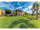 Beautiful home exterior featuring a screened-in lanai, lush landscaping, and well-maintained lawn at 318 Winding Brook Ln # 104, Bradenton, FL 34212