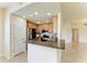 Bright kitchen showcases a breakfast bar, modern appliances, and tile flooring at 318 Winding Brook Ln # 104, Bradenton, FL 34212