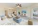 Spacious living room featuring neutral colors and golf course views at 318 Winding Brook Ln # 104, Bradenton, FL 34212
