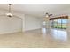 Spacious living room featuring neutral colors and a view of the golf course at 318 Winding Brook Ln # 104, Bradenton, FL 34212