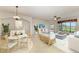 Bright living room featuring neutral colors and a view of the golf course at 318 Winding Brook Ln # 104, Bradenton, FL 34212