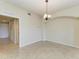 Open floor plan living room with arched doorway and tile flooring at 318 Winding Brook Ln # 104, Bradenton, FL 34212